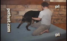 Teenage boy with black dog