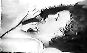 Animal sex - old black and white movie of woman giving dog a blowjob